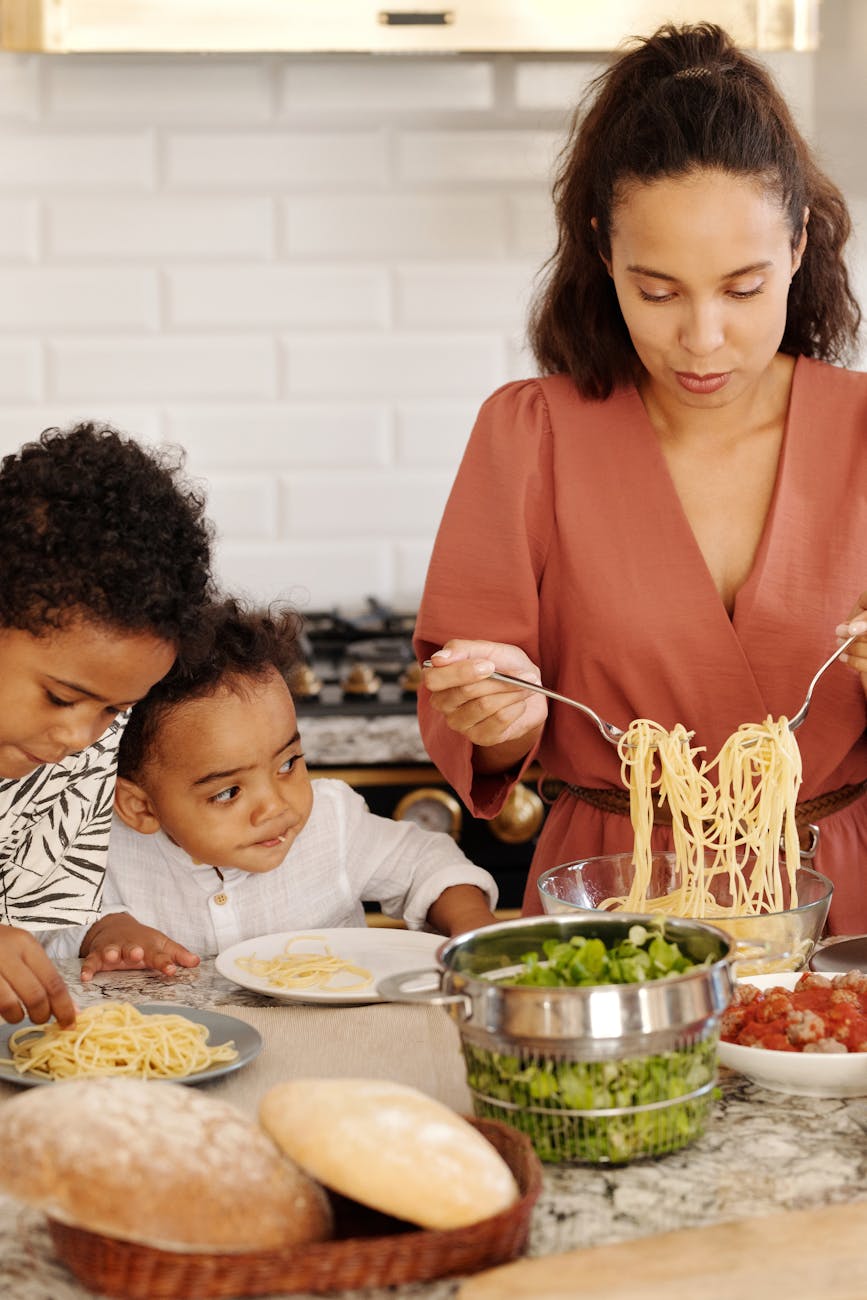 a woman preparing foods for her kids